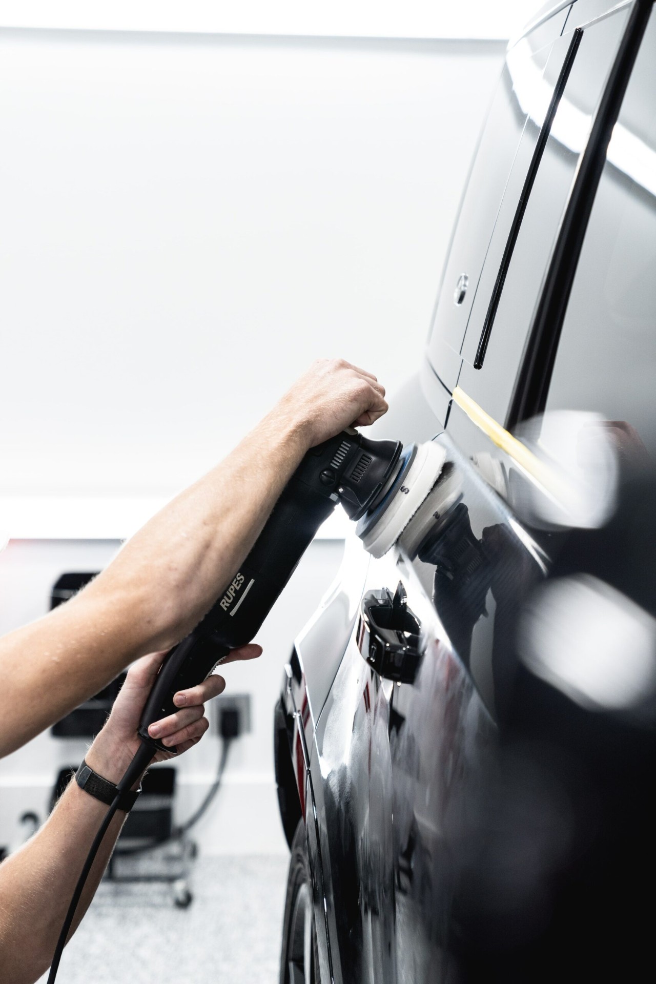 Machine polishing a black panel to a mirror finish before ceramic coating